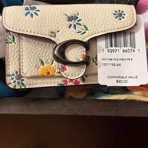 Coach mini clutch. Great for AirPods, or any small accessories